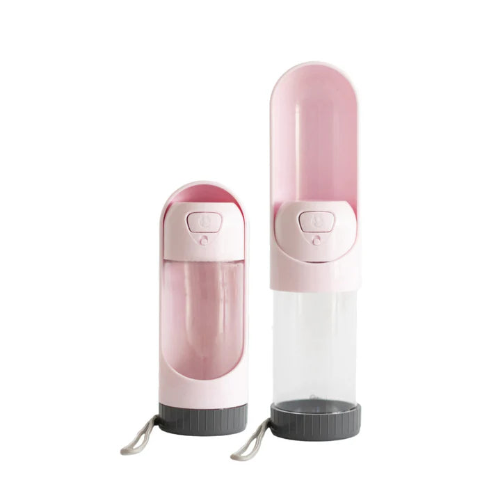 Pink portable dog water bottle with clear middle section
