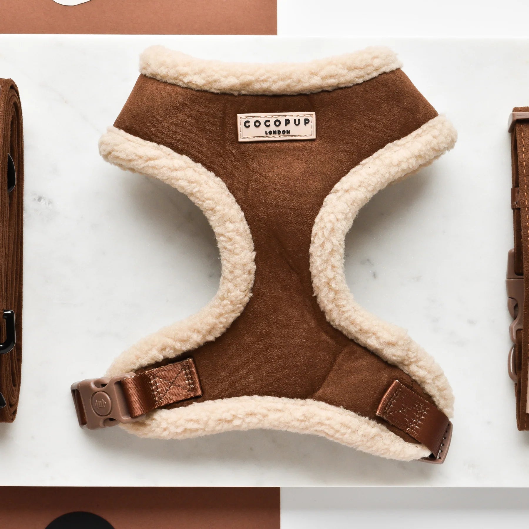 Brown dog harness with white fleece lining, featuring the CoCopup brand.