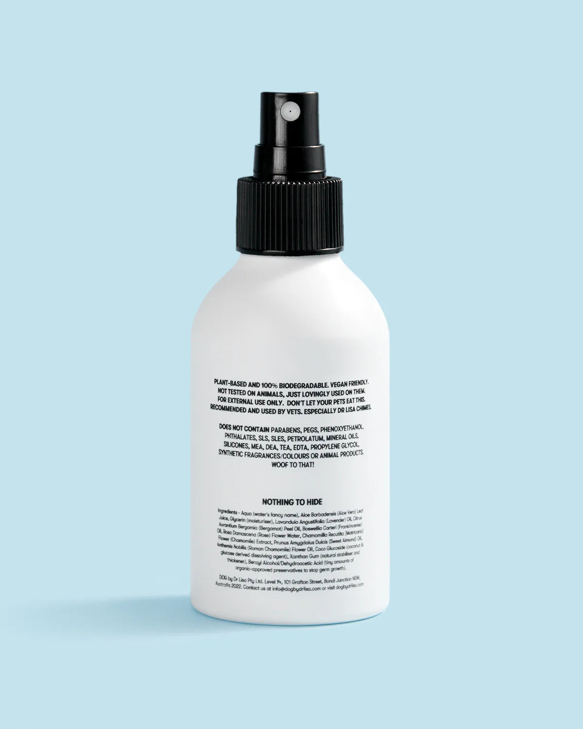 Dog cologne with black nozzle on a light blue background