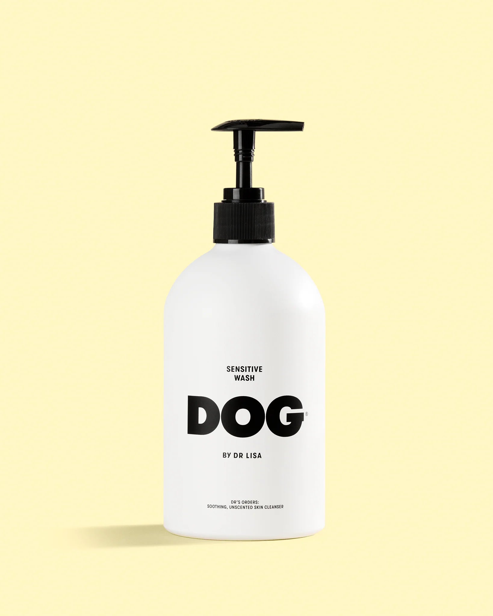 Dog shampoo bottle labeled 'Sensitive Wash Dog by Dr. Lisa' on a light yellow background