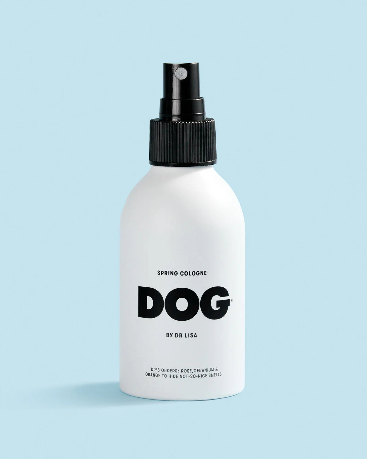 White spray bottle labeled 'DOG by Dr. Lisa'. Spring scented dog cologne