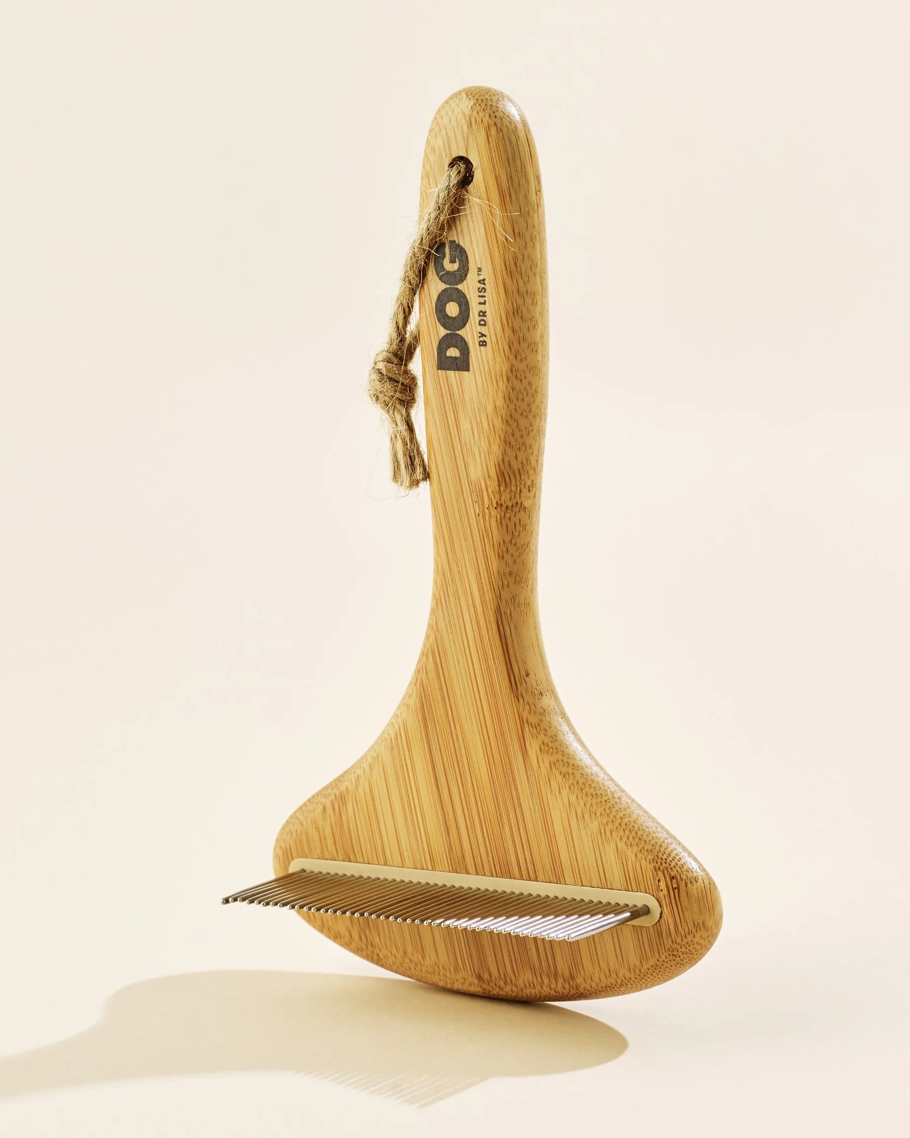 Wooden dog grooming brush with a rope handle
