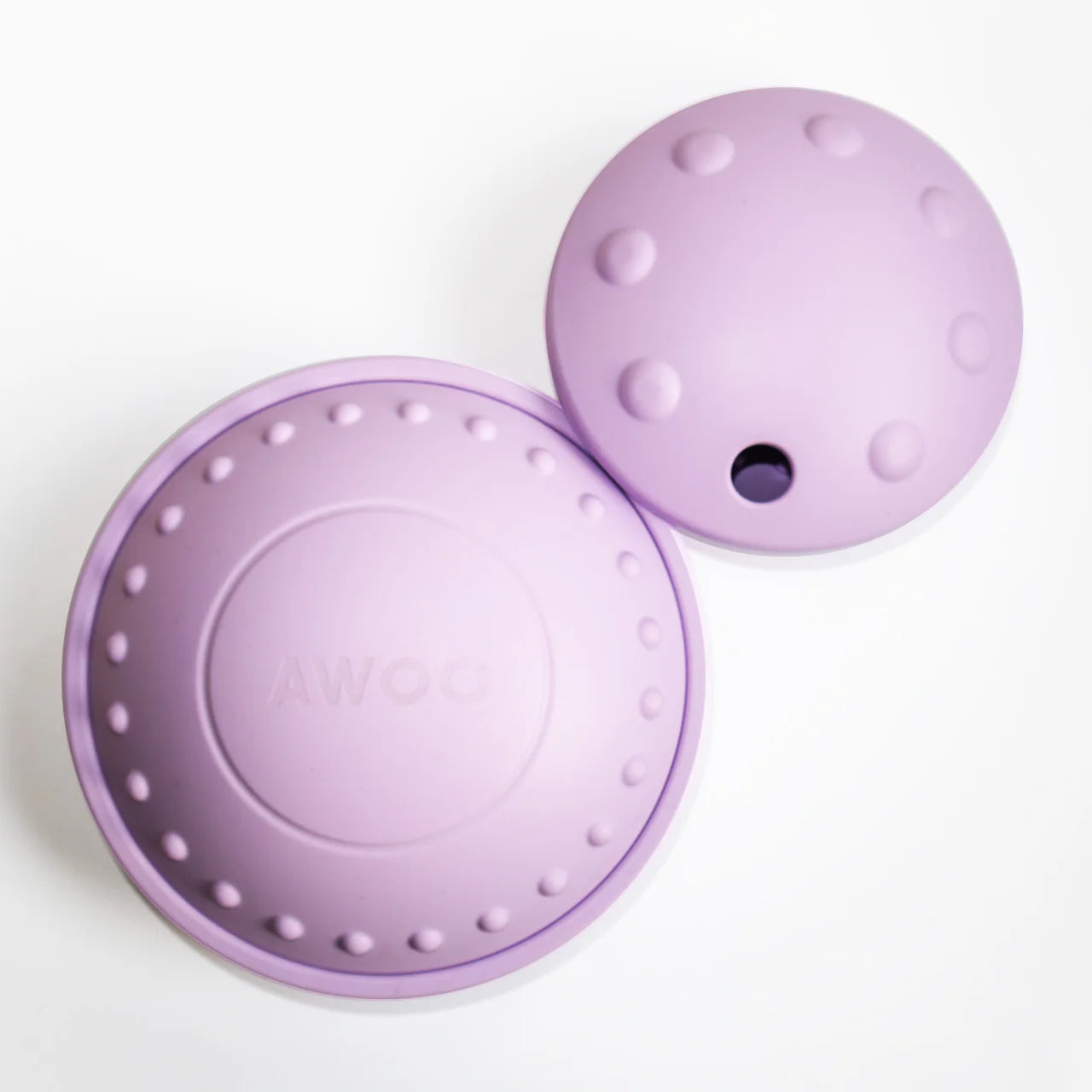 Two purple textured dog toys