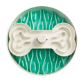 Teal and white slow feeder bowl with bone-shaped centre on a white background
