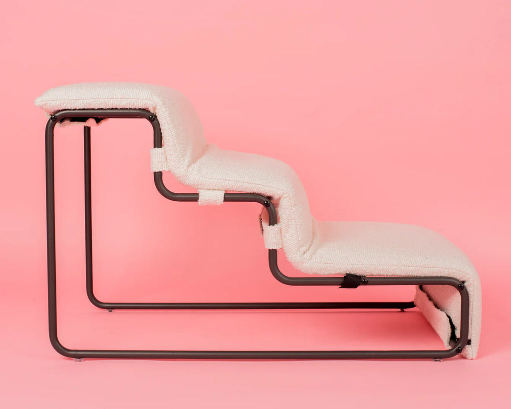 White boucle pet stairs on a pink background