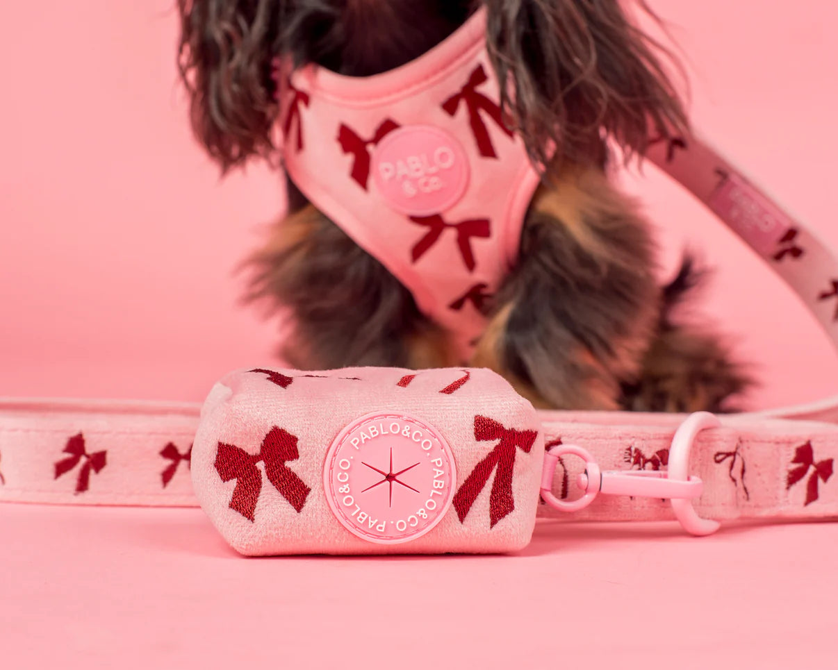 Pink bows poop bag holder with Pablo & Co branding