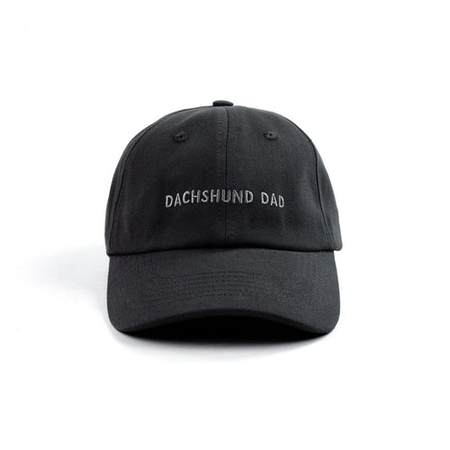 Black cap with 'DACHSHUND DAD' text on a white background