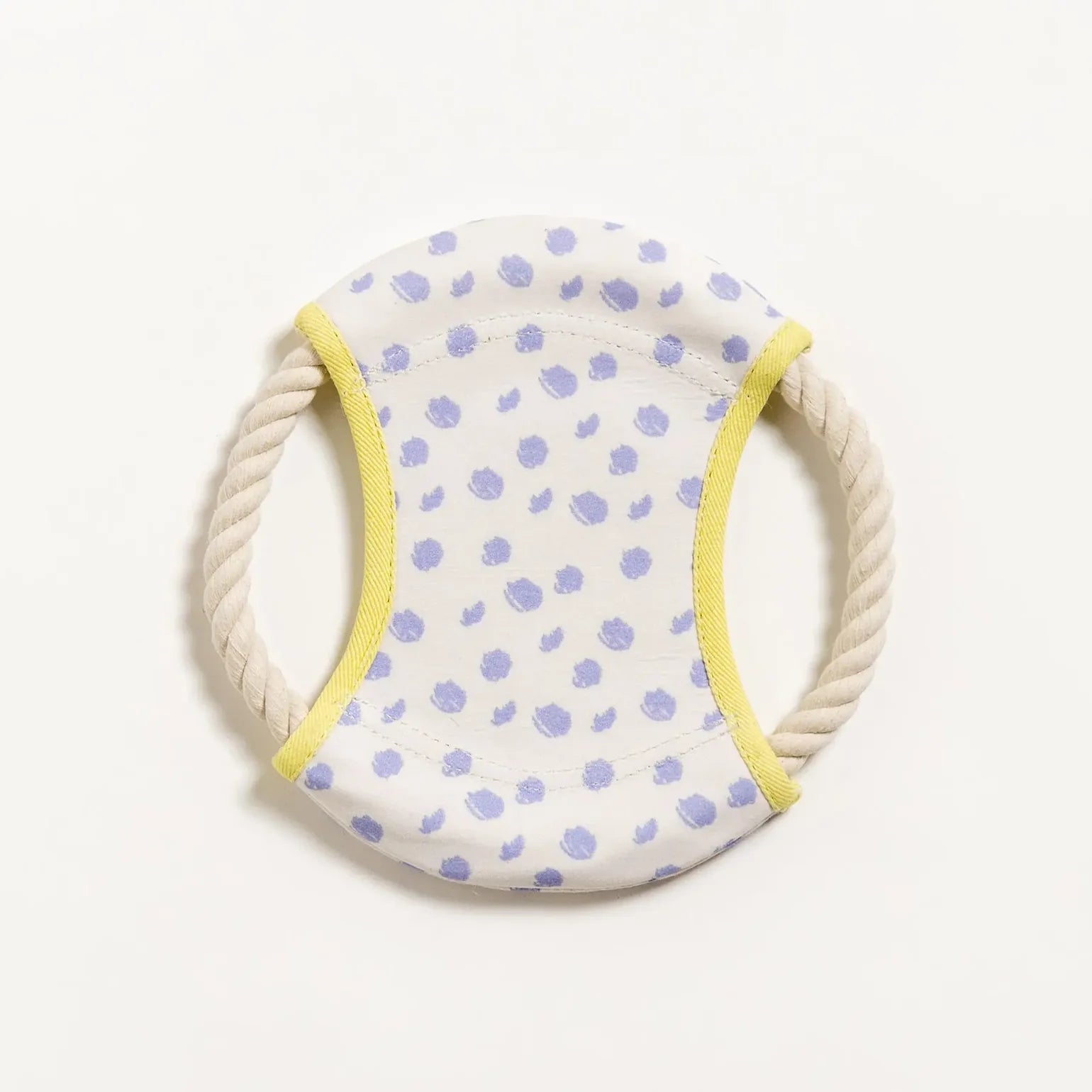 Dog frisbee toy with spot print pattern and yellow trim on a white background