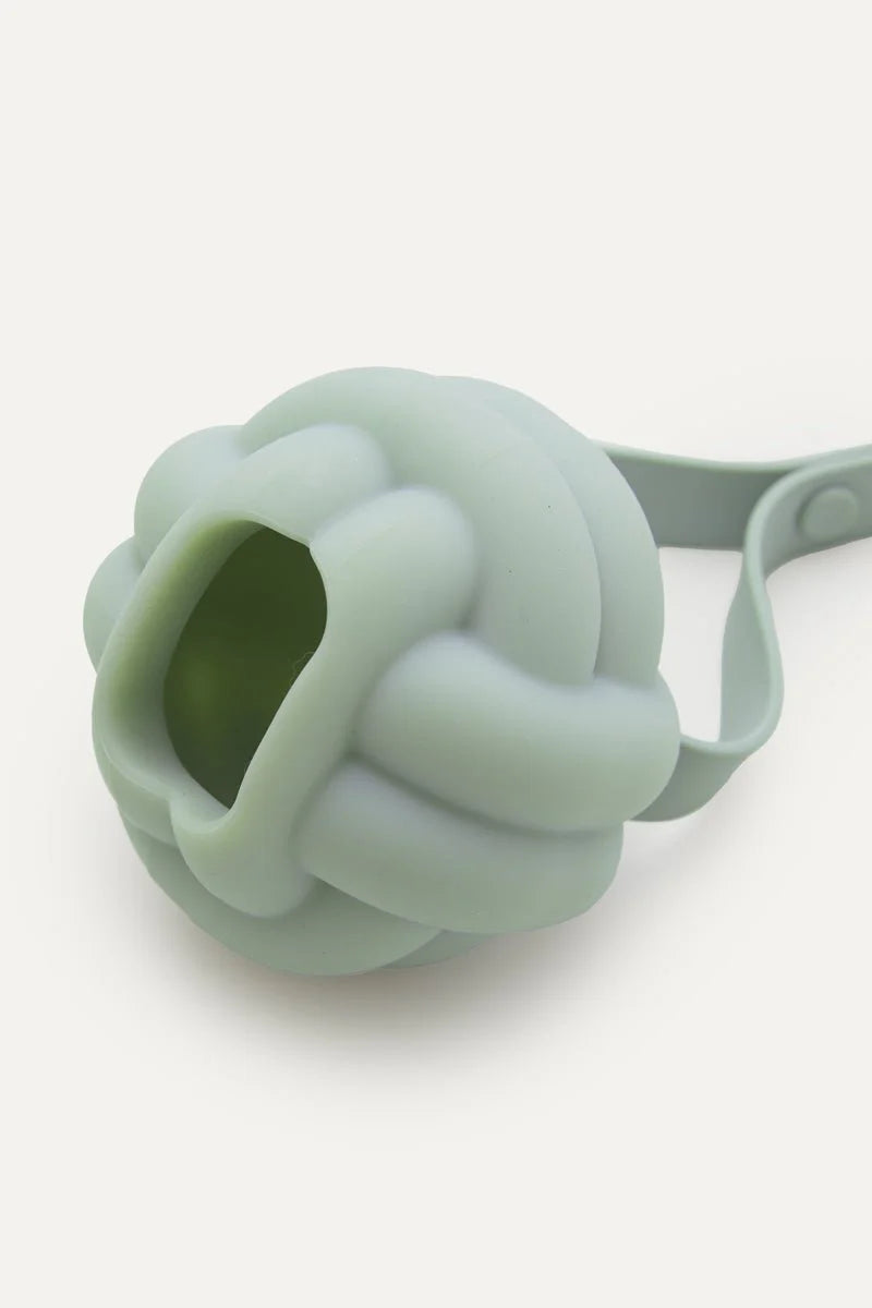 Silicone knot-shaped dog toy on a white background