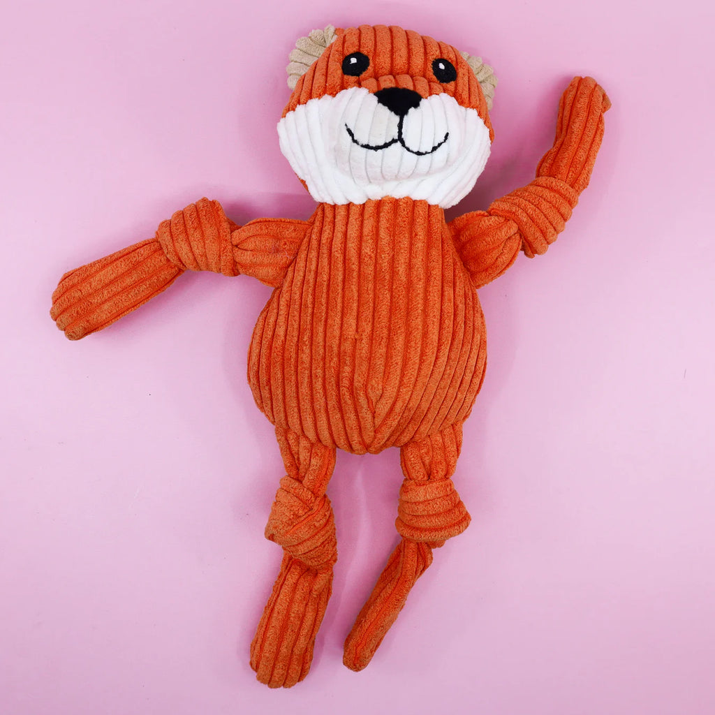Plush fox dog toy on a pink background