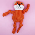 Plush fox dog toy on a pink background