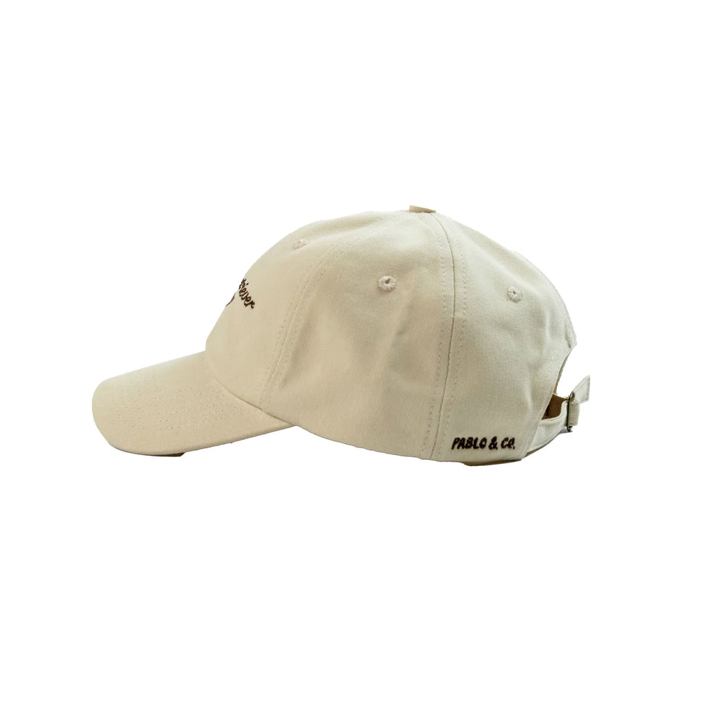 Beige cap with brand logo on a white background