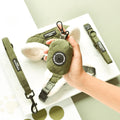 Green pet accessories including a collar, harness and poop bag holder