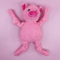 Pink plush pig dog toy on a pink background