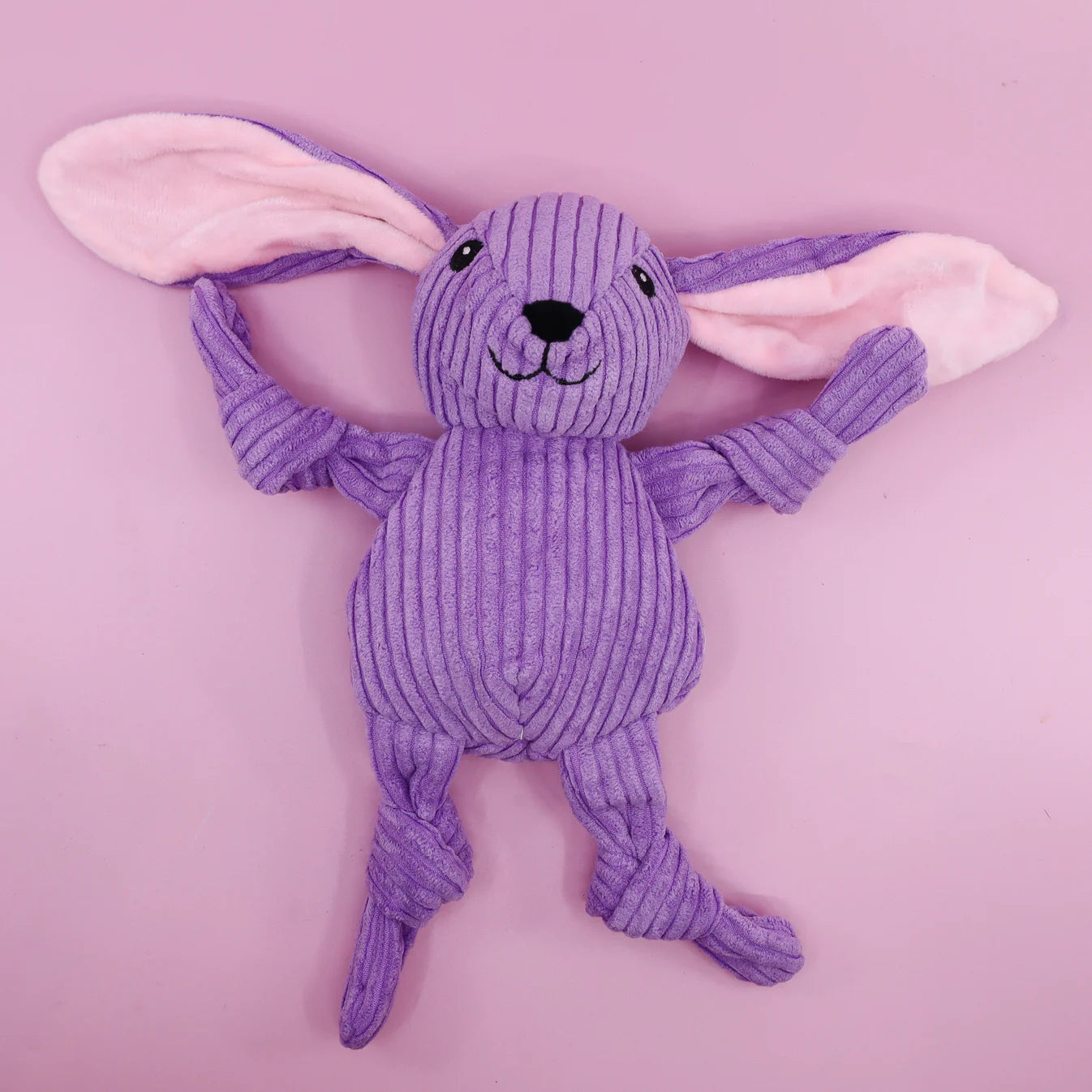 Purple plush bunny dog toy